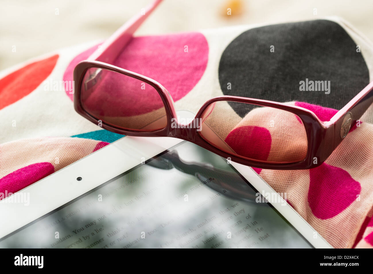 Close Up of a White Ipad Mini and Sunglasses on Holiday Stock Photo