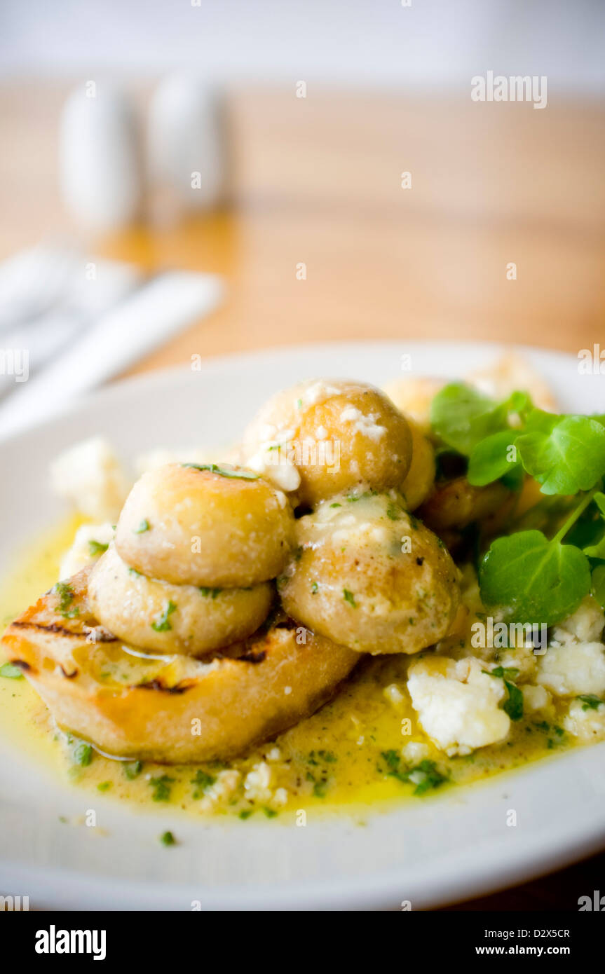 Mushroom Bruschetta Pan fried in an olive oil garlic butter blend, with crumbled goats cheese