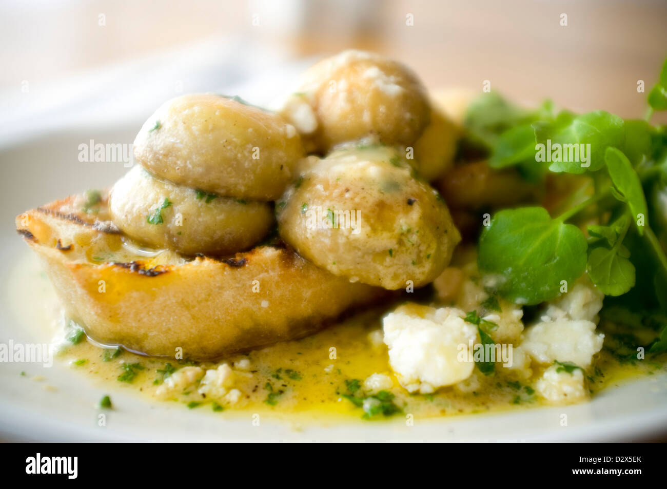 Mushroom Bruschetta Pan fried in an olive oil garlic butter blend, with crumbled goats cheese