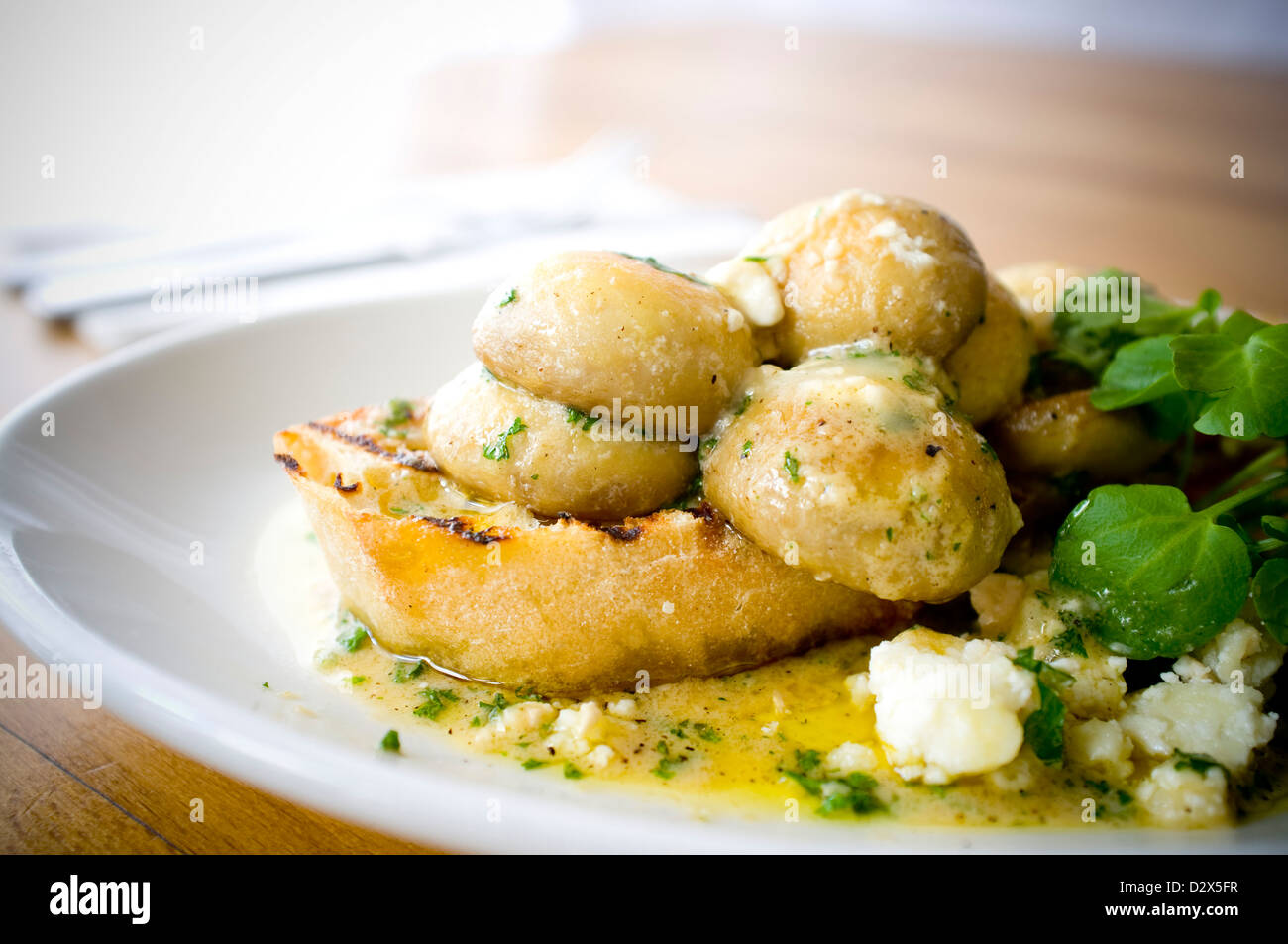 Mushroom Bruschetta Pan fried in an olive oil garlic butter blend, with crumbled goats cheese