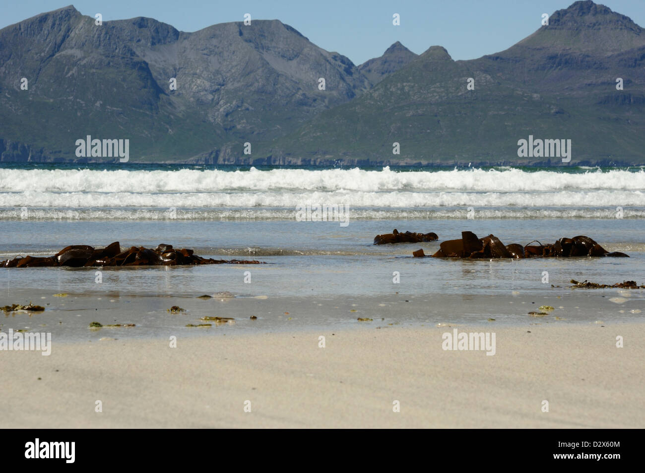 Rùm and the incoming tide from Laig Beach on Eigg Stock Photo