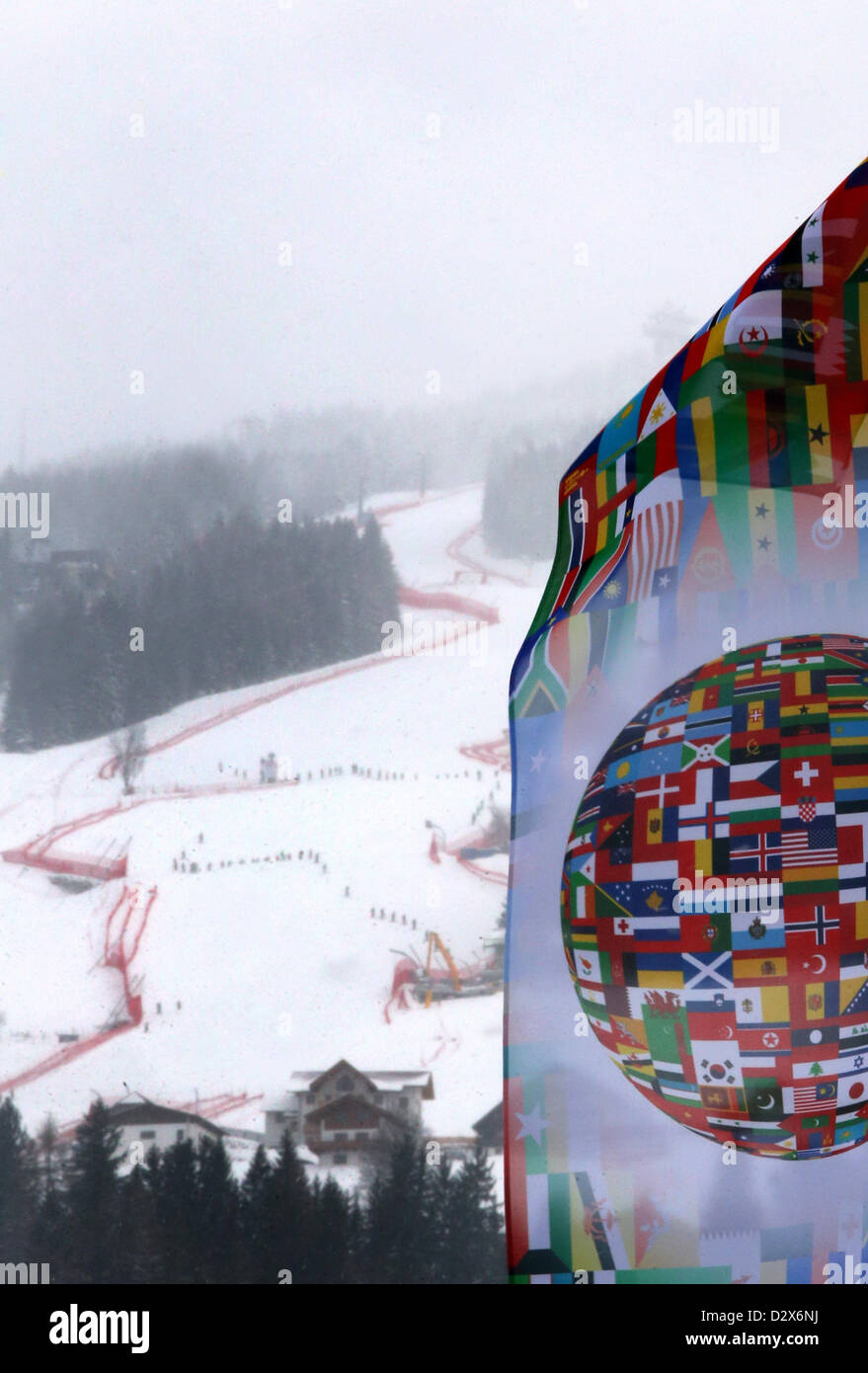 A flag that shows flags of different countries all over the world waves