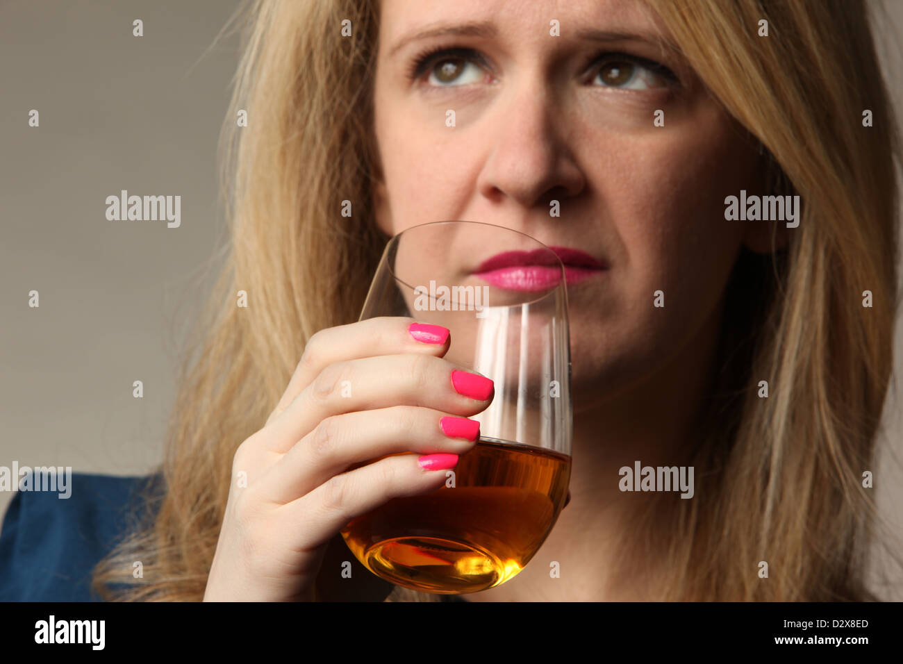 Young woman troubled by alcohol addiction, January 23, 2013, © Katharine Andriotis Stock Photo