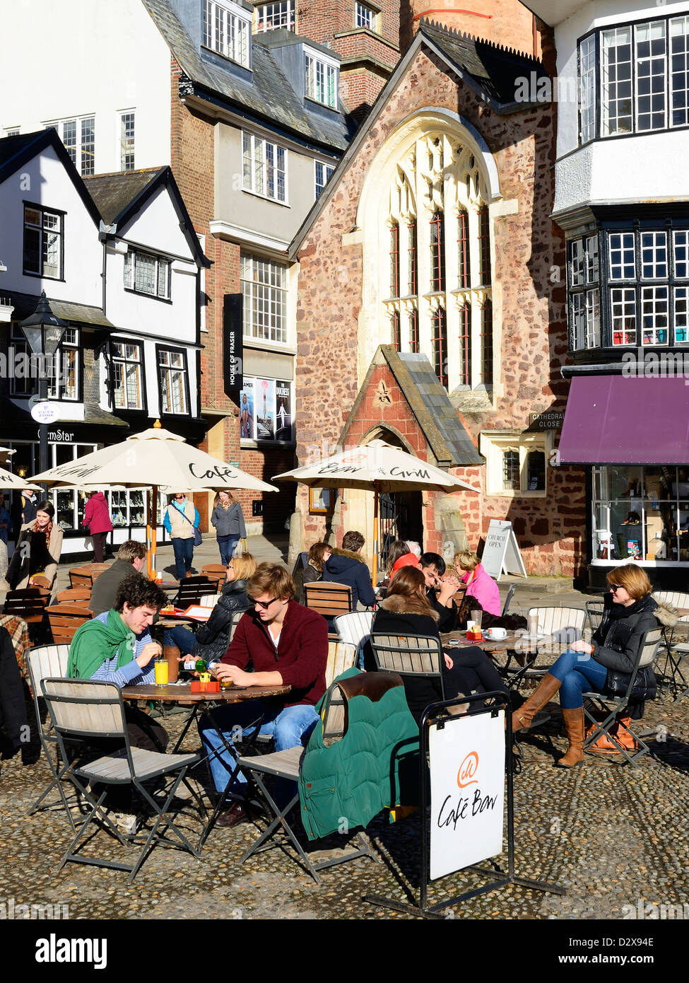 tourists having drinks sitting outside 'Mols ' coffee shop in cathedral square, exeter, devon, uk Stock Photo