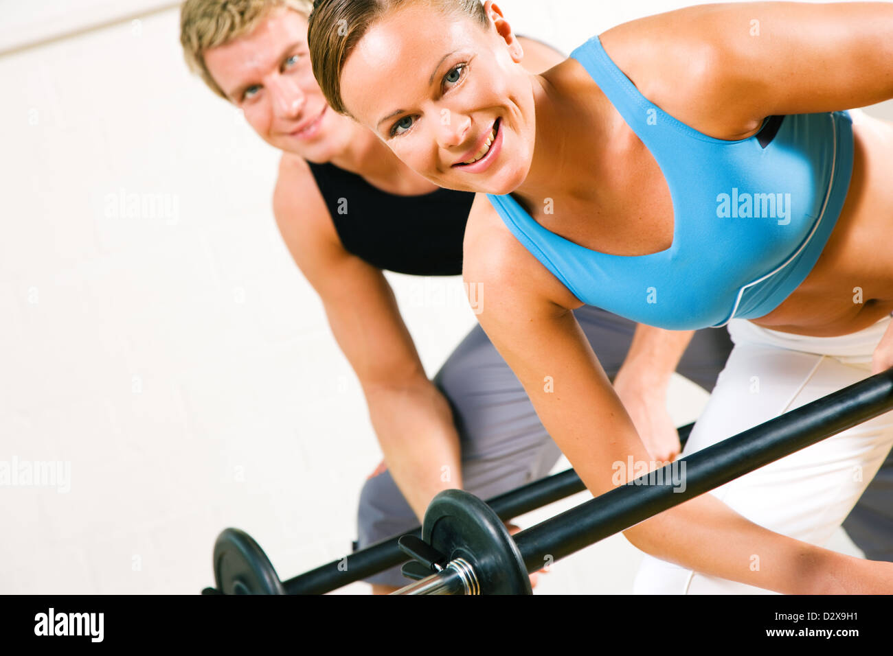 Very Attractive And Sportive Couple Doing Power Gymnastics With