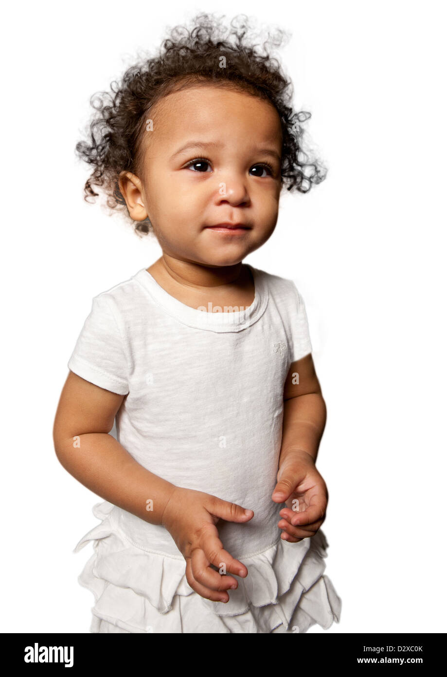 Studio portraits of mixed race toddler girl wearing a white vest