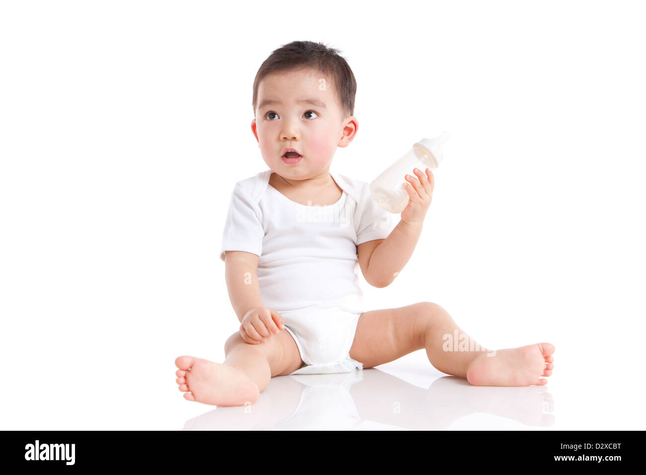 Cute baby boy with baby bottle Stock Photo - Alamy