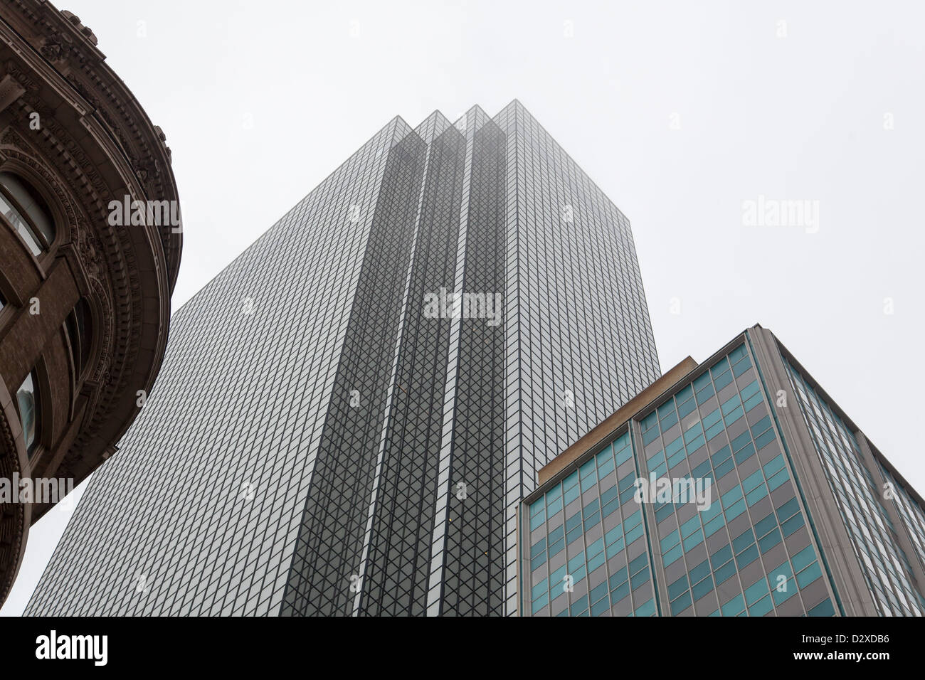 View from below of the tops of three buildings of varying ages in Dallas, Texas. Stock Photo