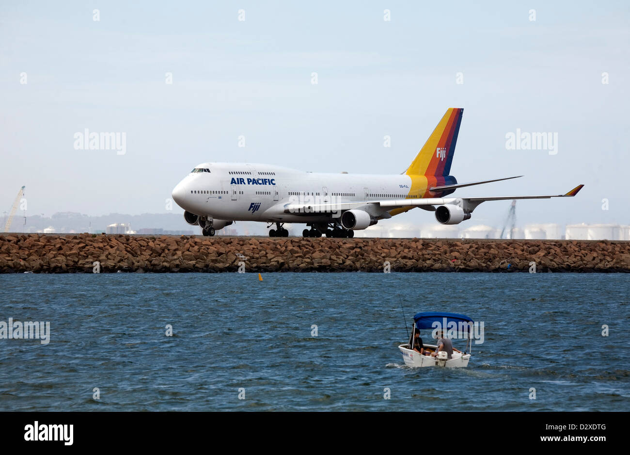 Air Pacific Jumbo Jet taxiing along runway at Mascot Airport Sydney Australia Stock Photo