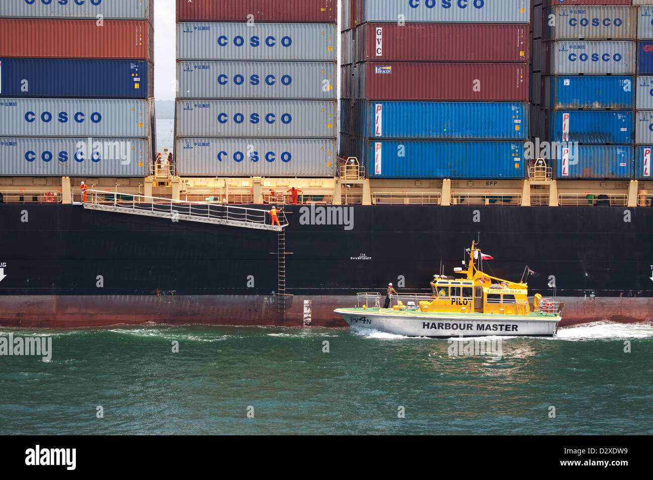 Pilot vessel alongside the Singapore owned Kota Lumayan Container Ship ...