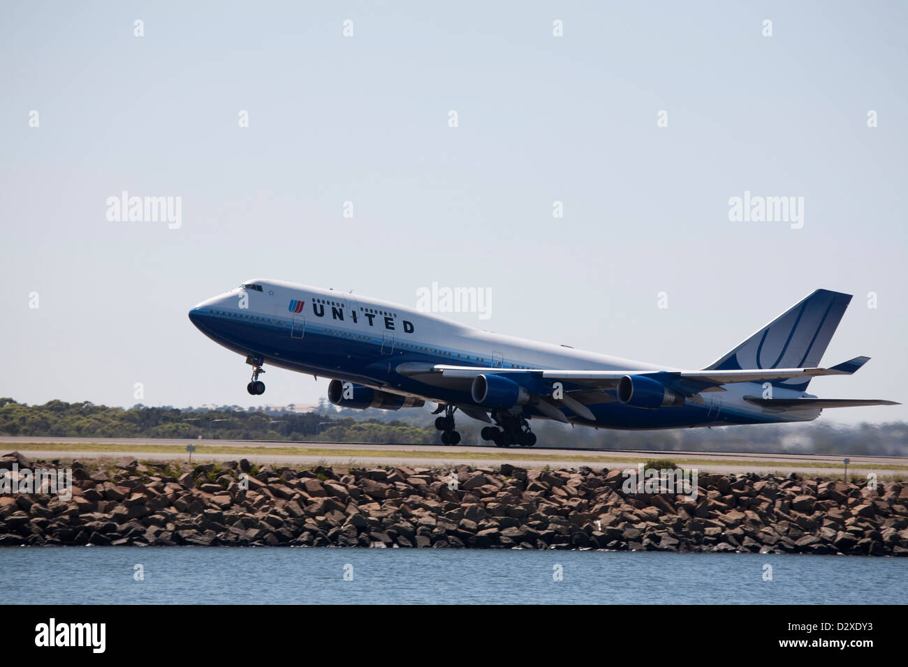 United airlines Jet Aircraft in takeoff mode from Kingsford Smith Airport Sydney Australia Stock Photo