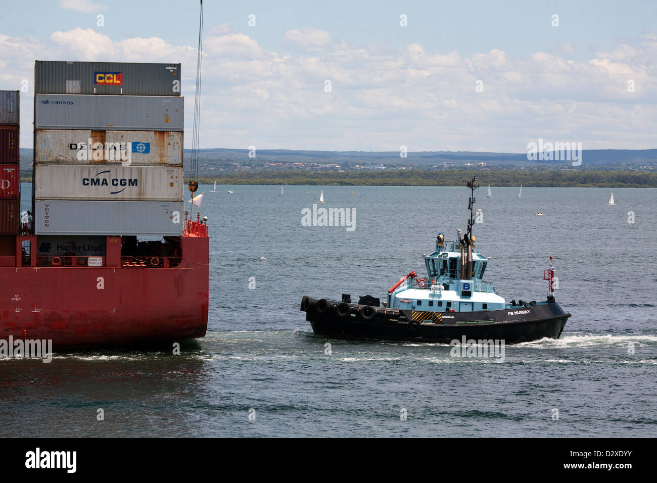 Cap Bon Container Ship being assisted by Port Botany Tug Boat 'Murray' leaving Port Botany Sydney Australia Stock Photo