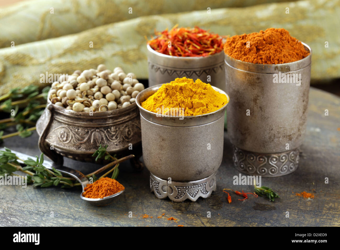 various spices (curcuma, paprika, saffron, coriander) in metal bowls