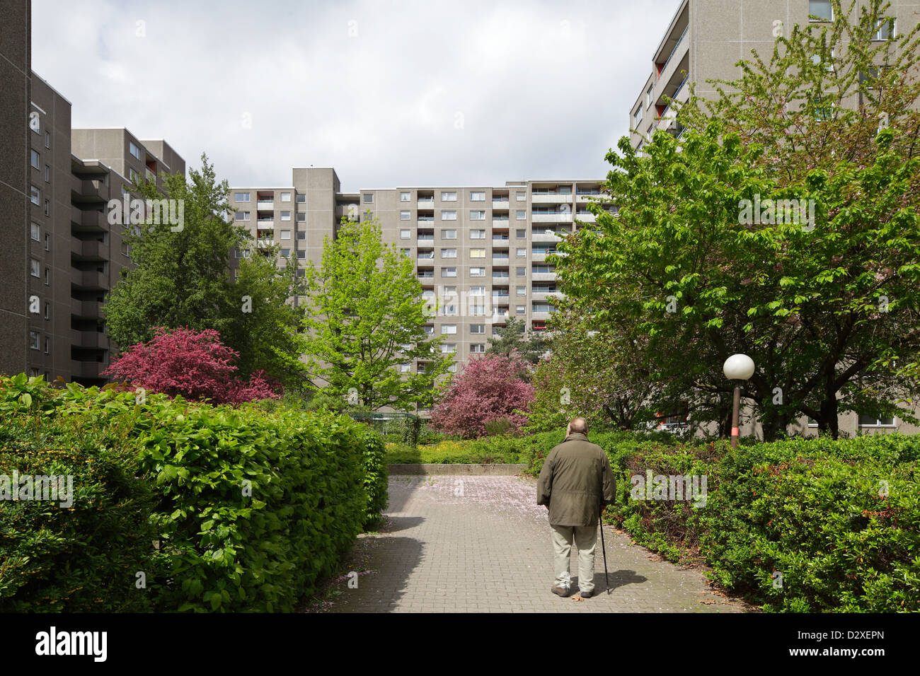 Berlin, Germany, an old man in front of a residential building in Gropiusstadt Stock Photo