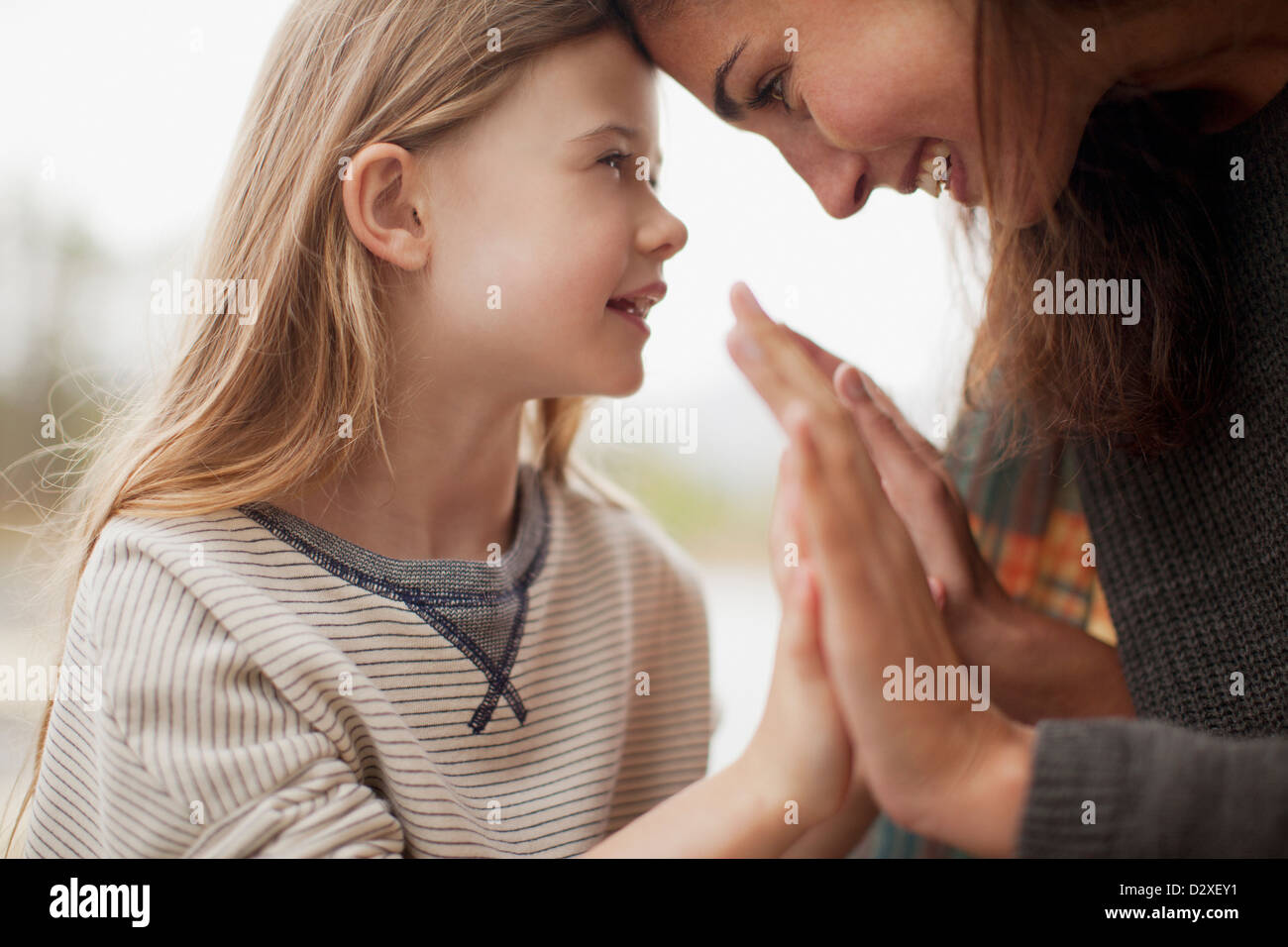 Close up of mother and daughter holding hands Stock Photo