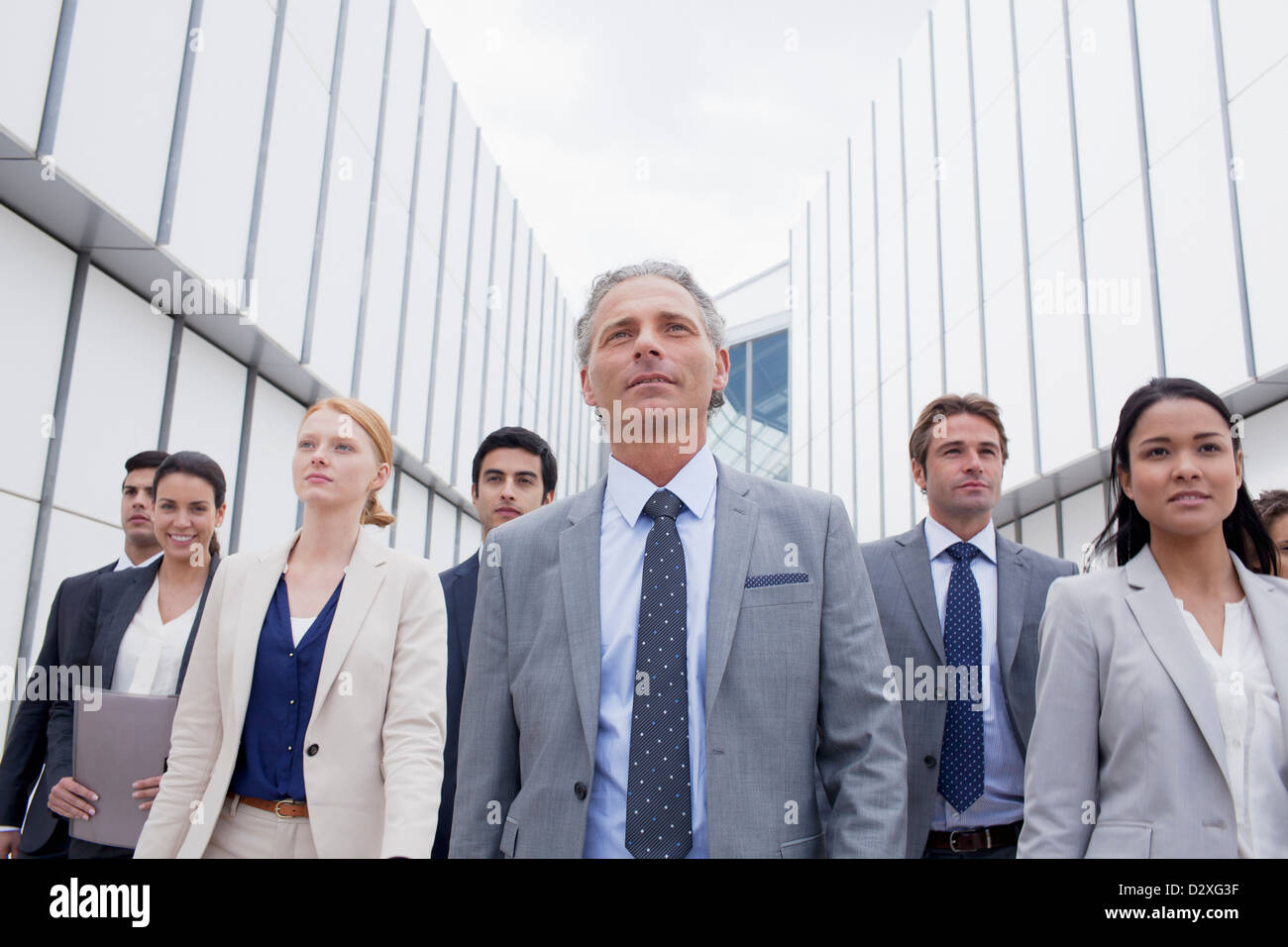 Confident business people looking ahead Stock Photo