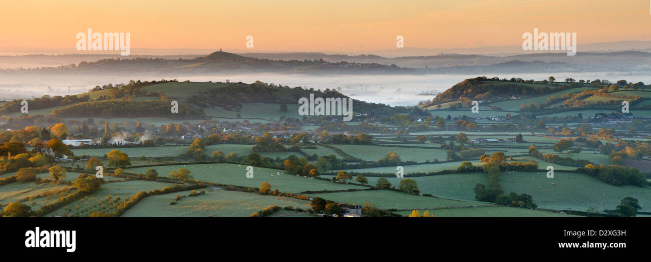 Panoramic view of the Somerset Levels and Glastonbury Tor on a misty autumn morning. Stock Photo