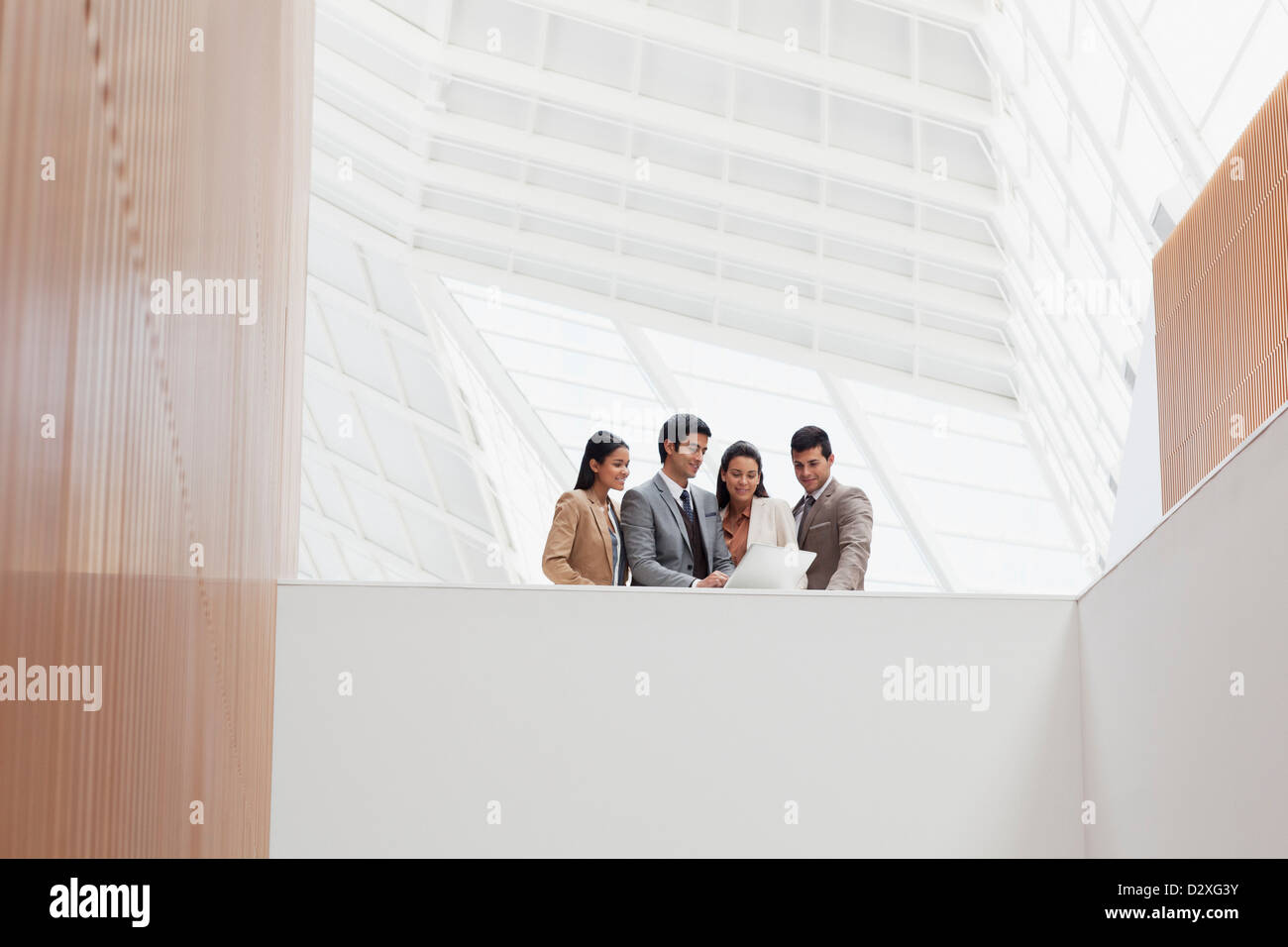 Business people reviewing paperwork in modern building Stock Photo - Alamy