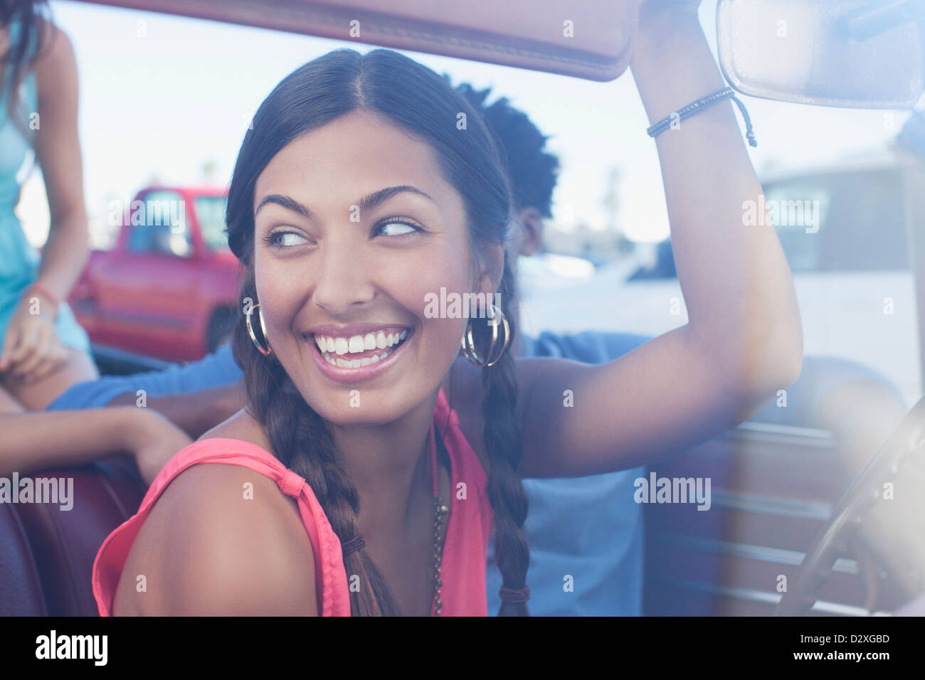 Smiling woman sitting in car Stock Photo