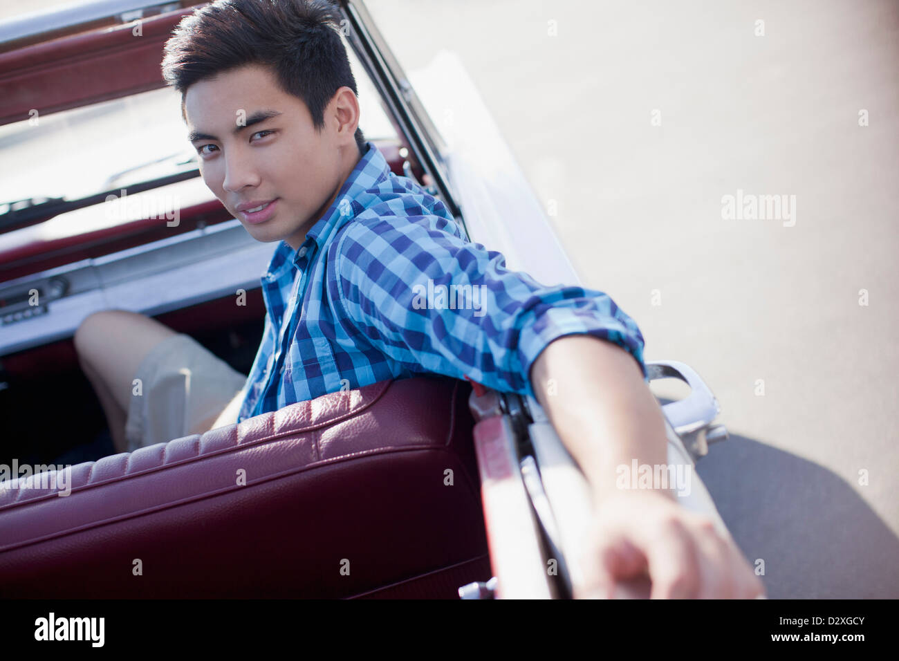 Man sitting in convertible Stock Photo