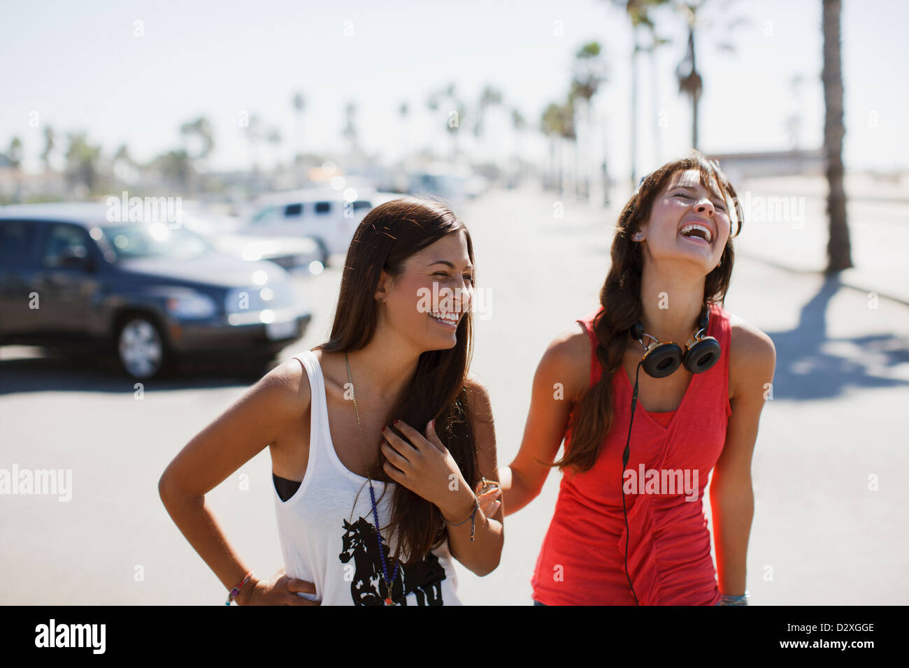 Laughing women walking outdoors Stock Photo