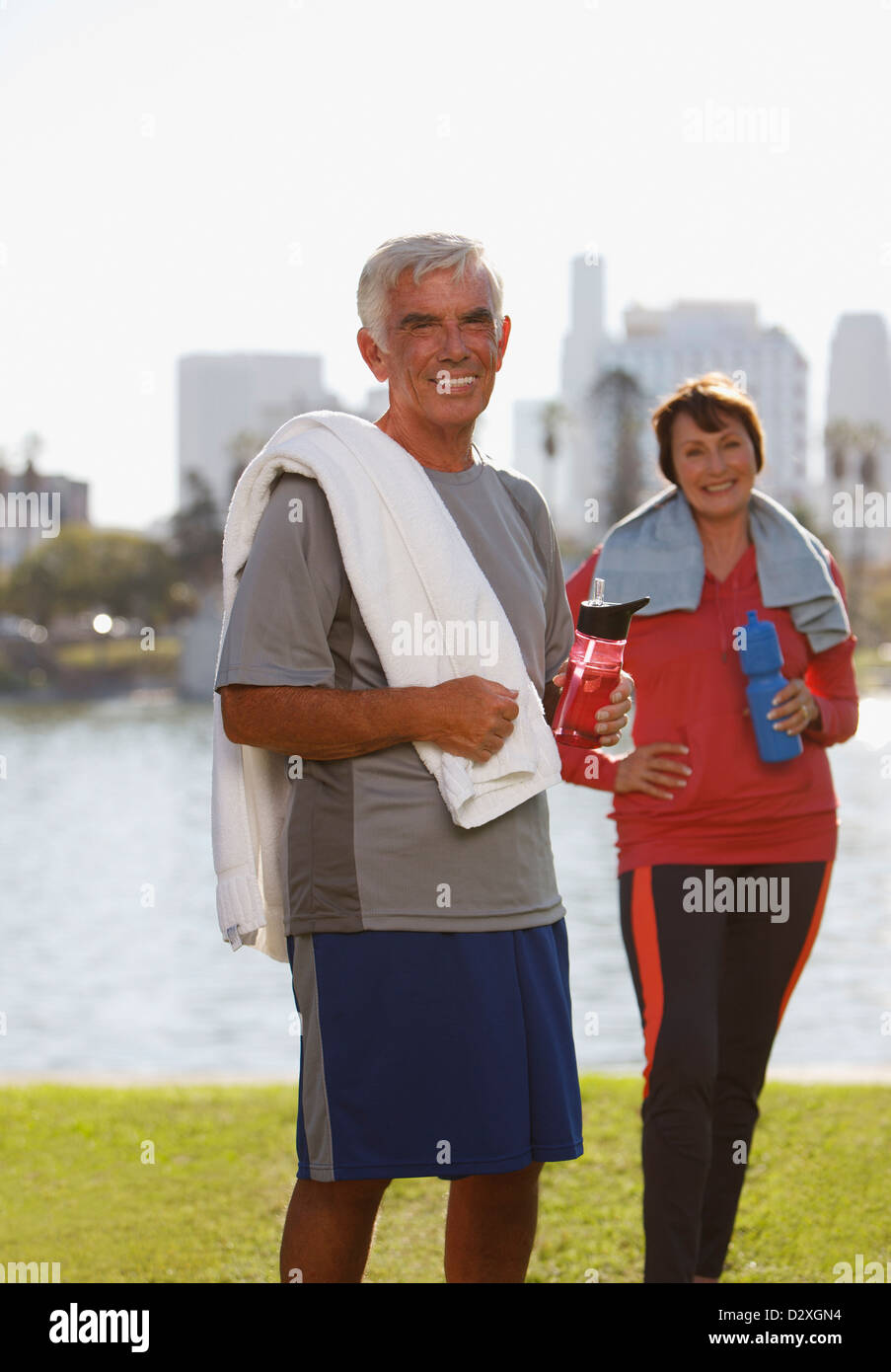 Older couple drinking water after workout Stock Photo