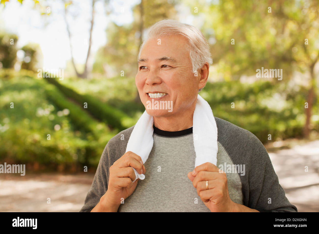 Smiling older man resting after workout Stock Photo