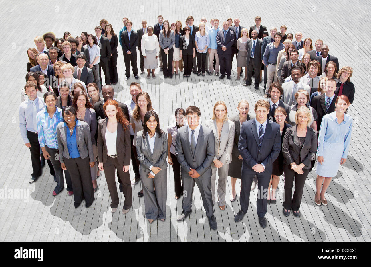 Portrait of smiling business people forming circle Stock Photo