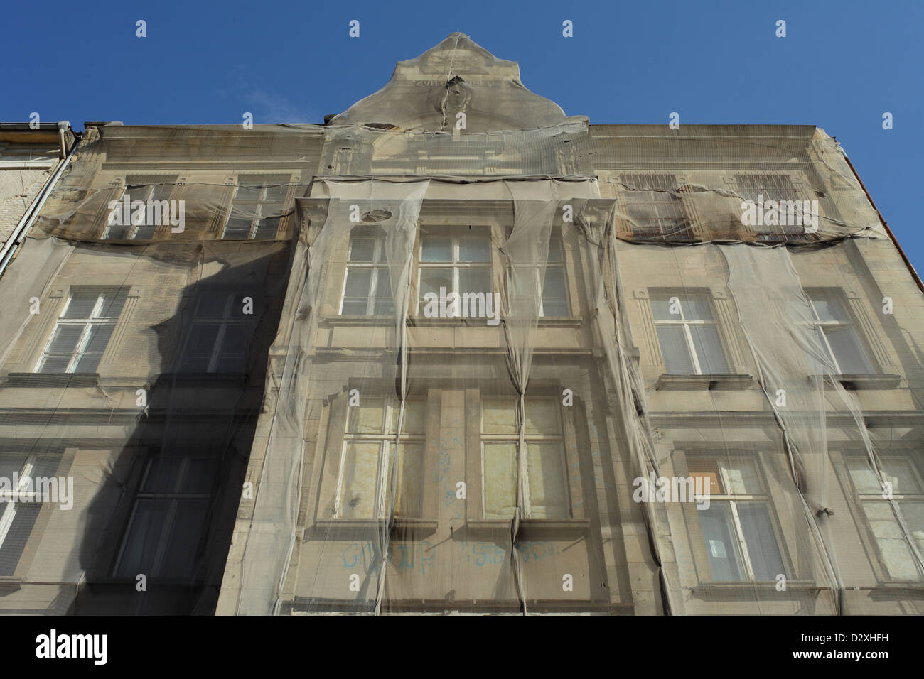 Berlin, Germany, gauze before an unrenovated old protects against falling facade parts Stock Photo
