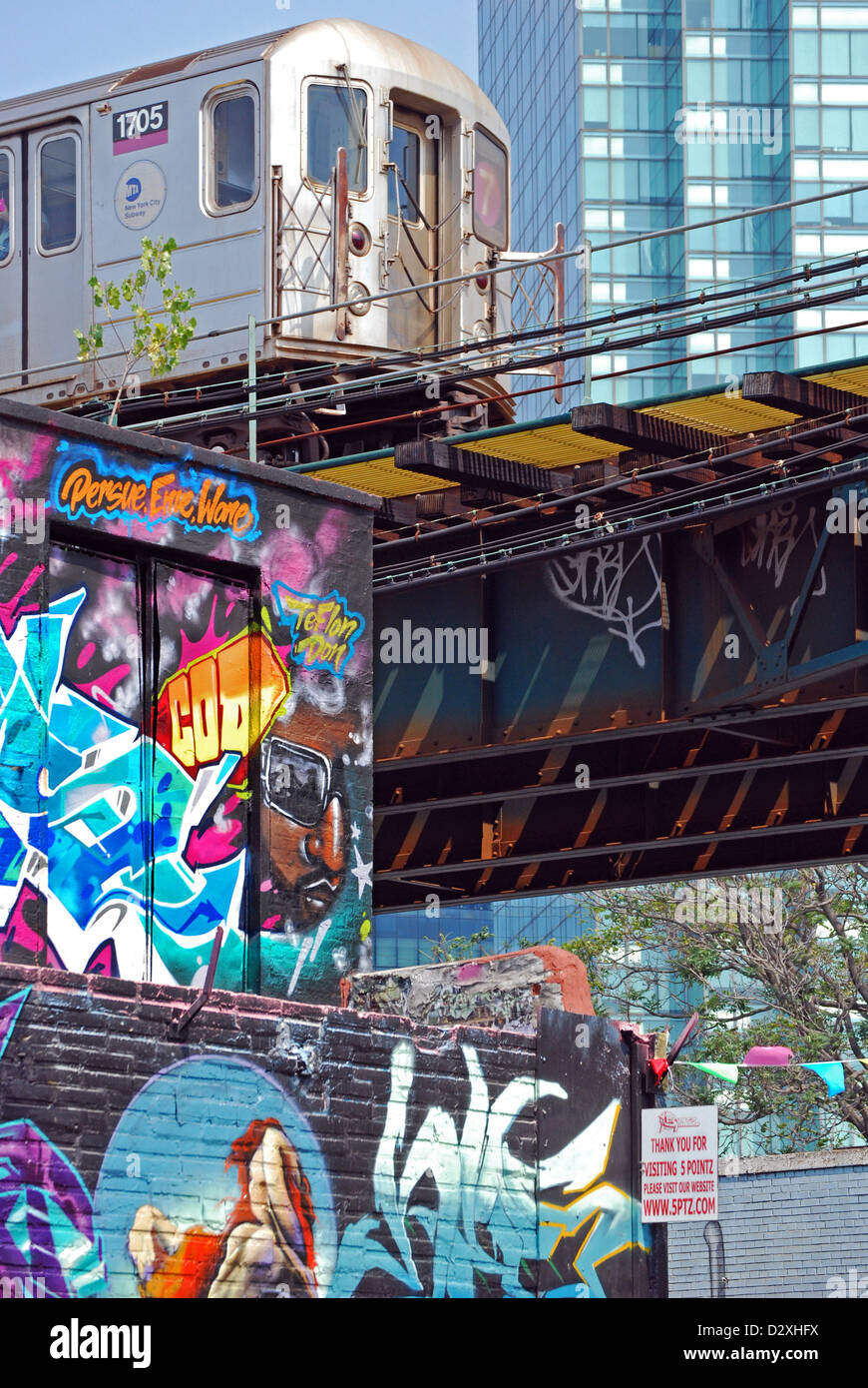 In Long Island City, Queens, a view of 5 Pointz graffiti, the Citi-Corp building and the #7 subway Stock Photo