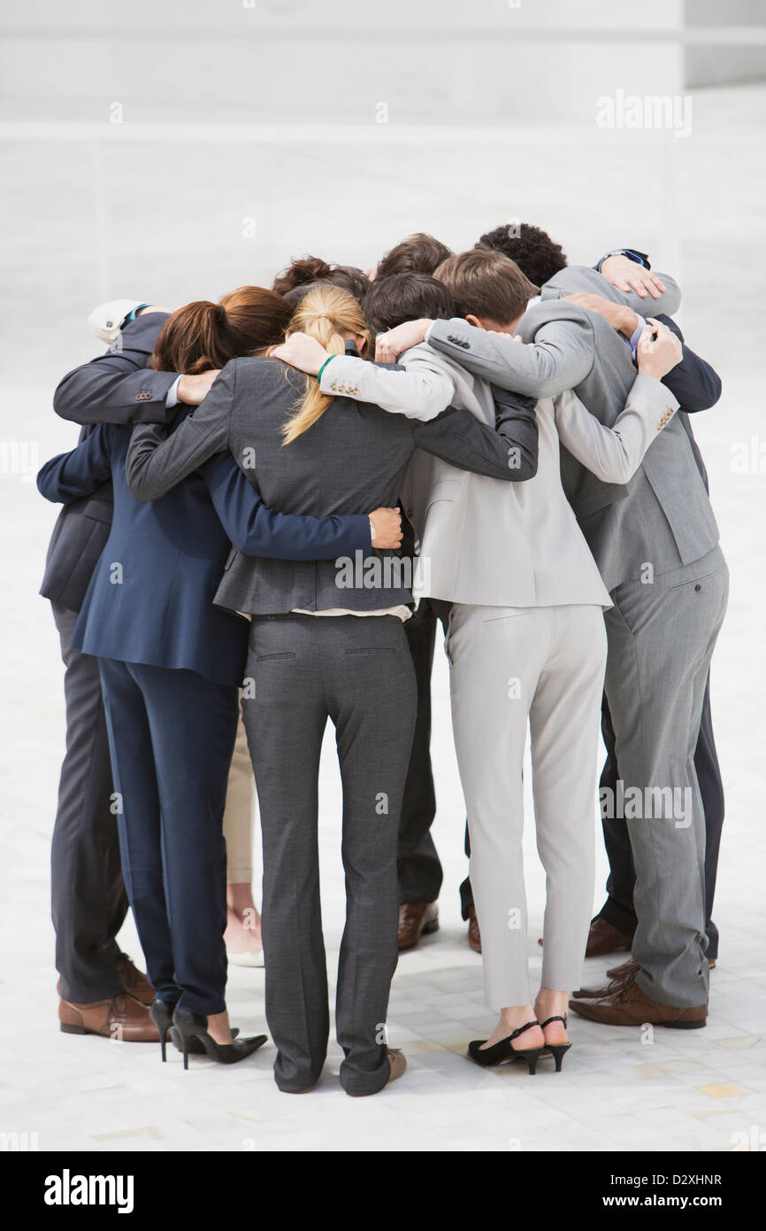 Business people in huddle Stock Photo