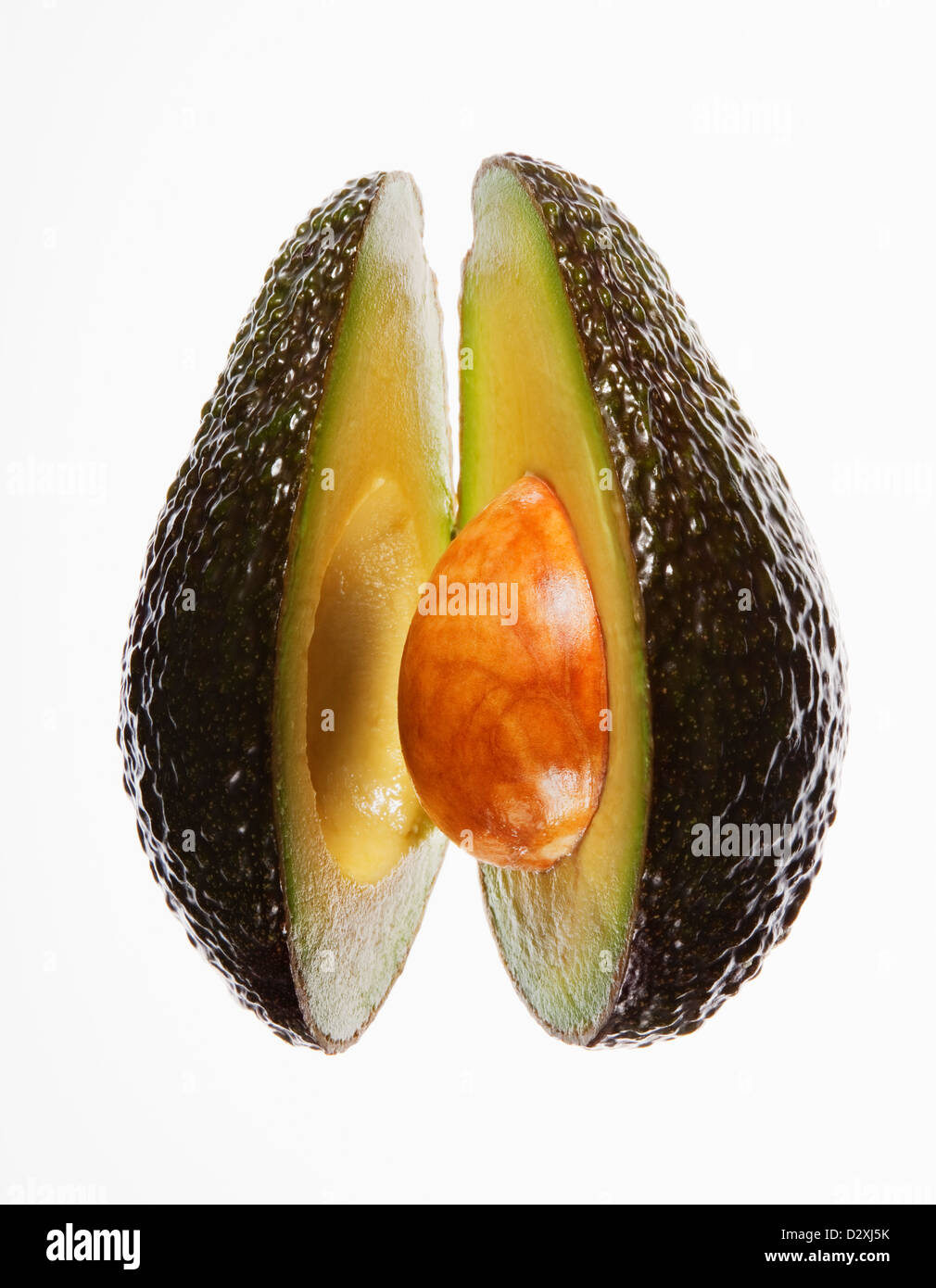 Close up of split avocado Stock Photo