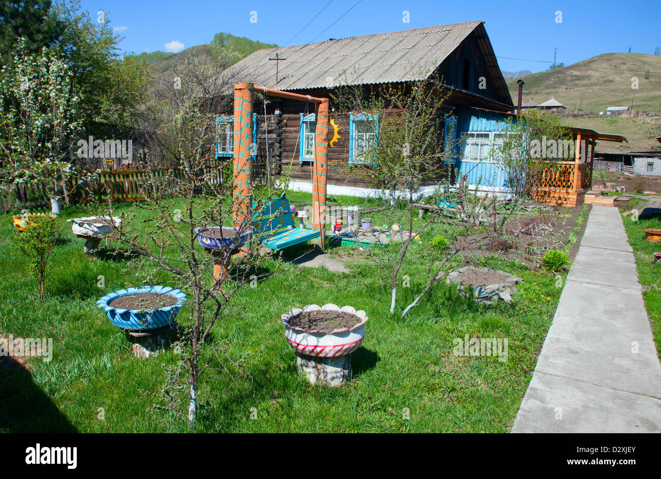 wooden country house with front garden Stock Photo - Alamy