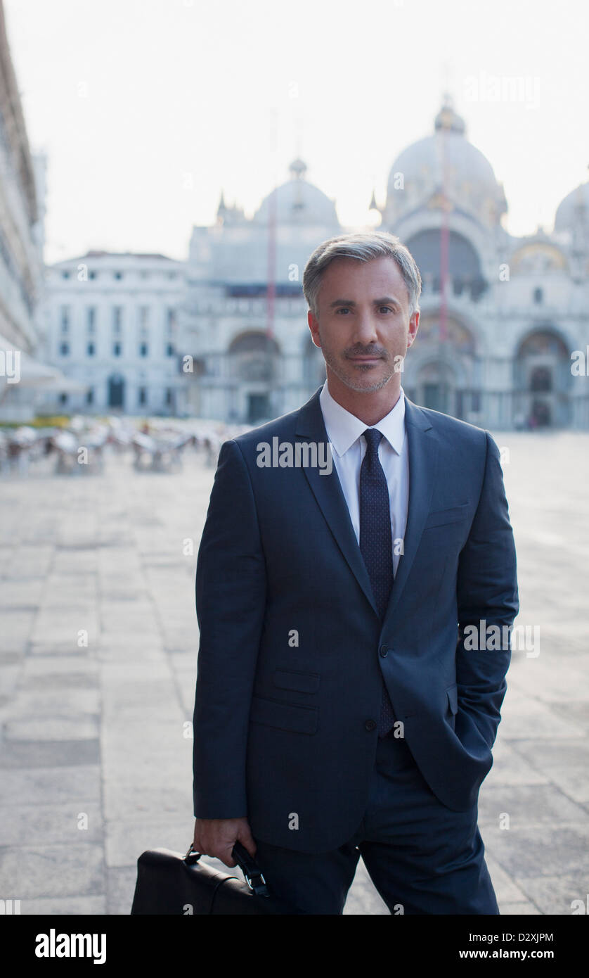Portrait of confident businessman in St. Mark's Square in Venice Stock Photo