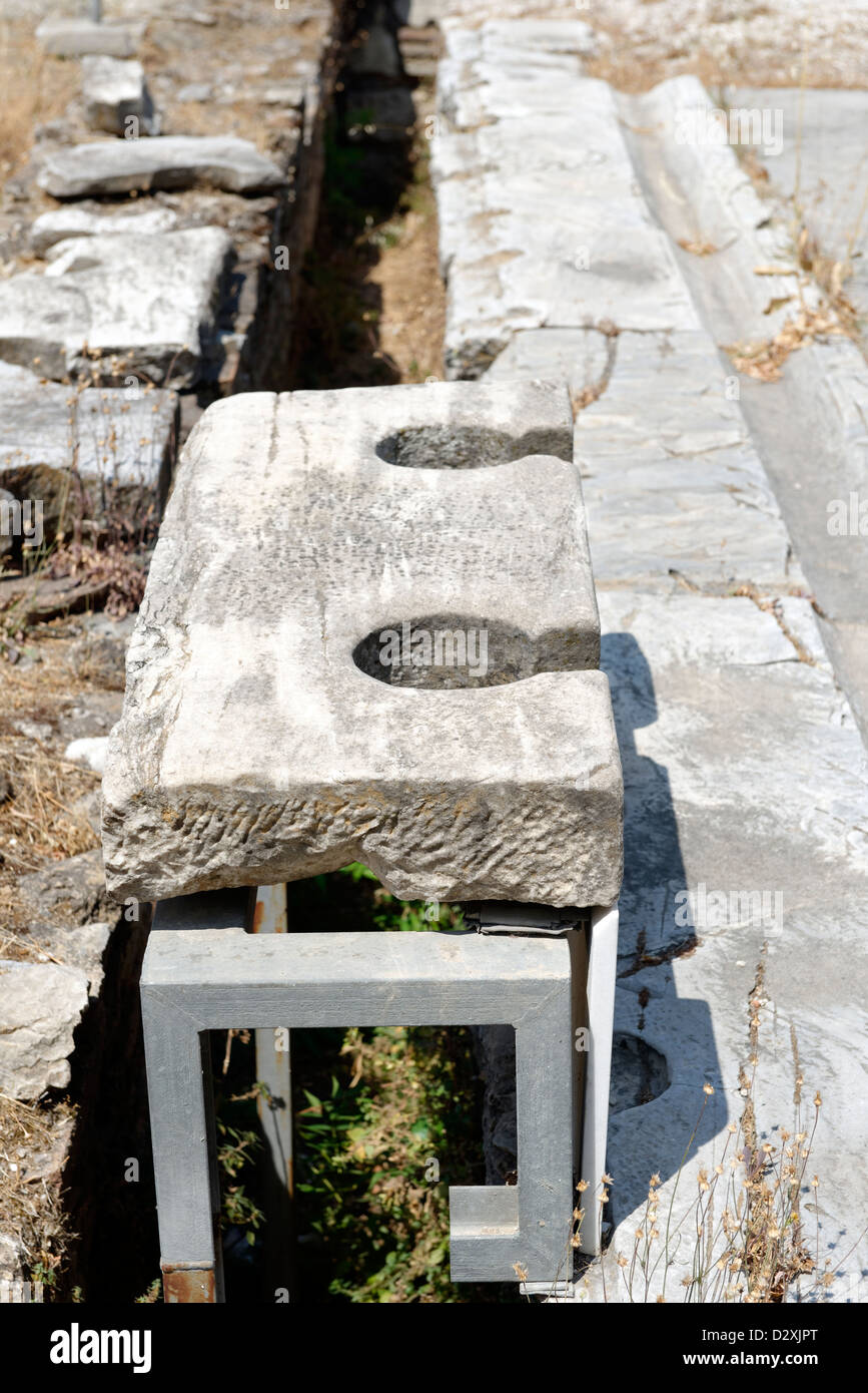 Athens. Greece. Ancient toilet seats from the public latrines (Vespasiane) that served people who visited the Roman Agora. Stock Photo