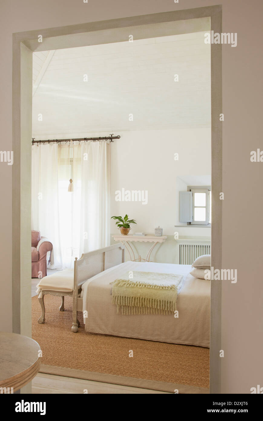 View of luxury bedroom through doorway Stock Photo
