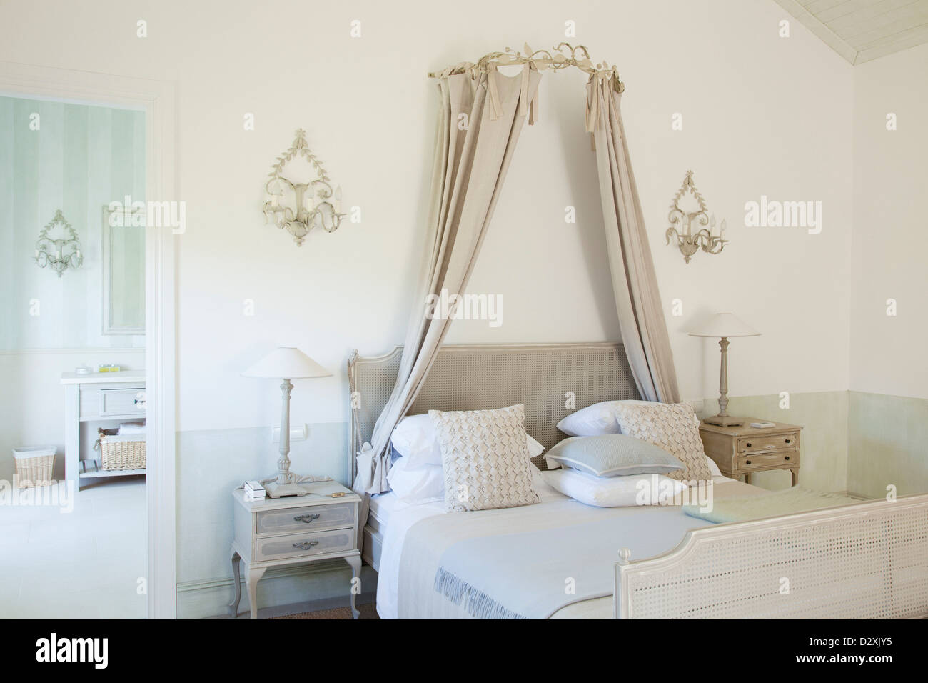Bed with canopy in luxury bedroom Stock Photo