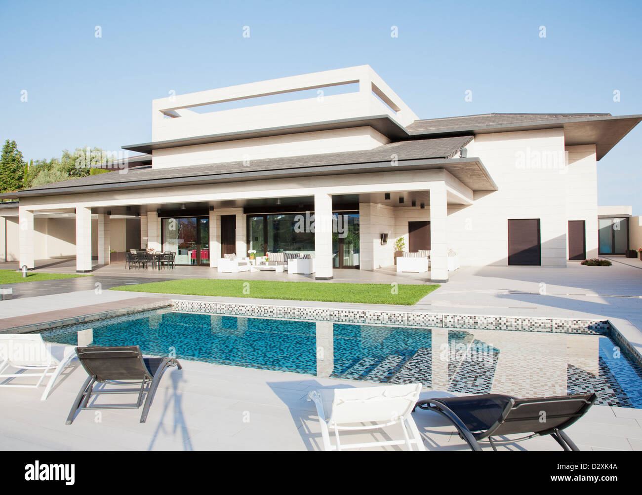 Luxury swimming pool and house Stock Photo