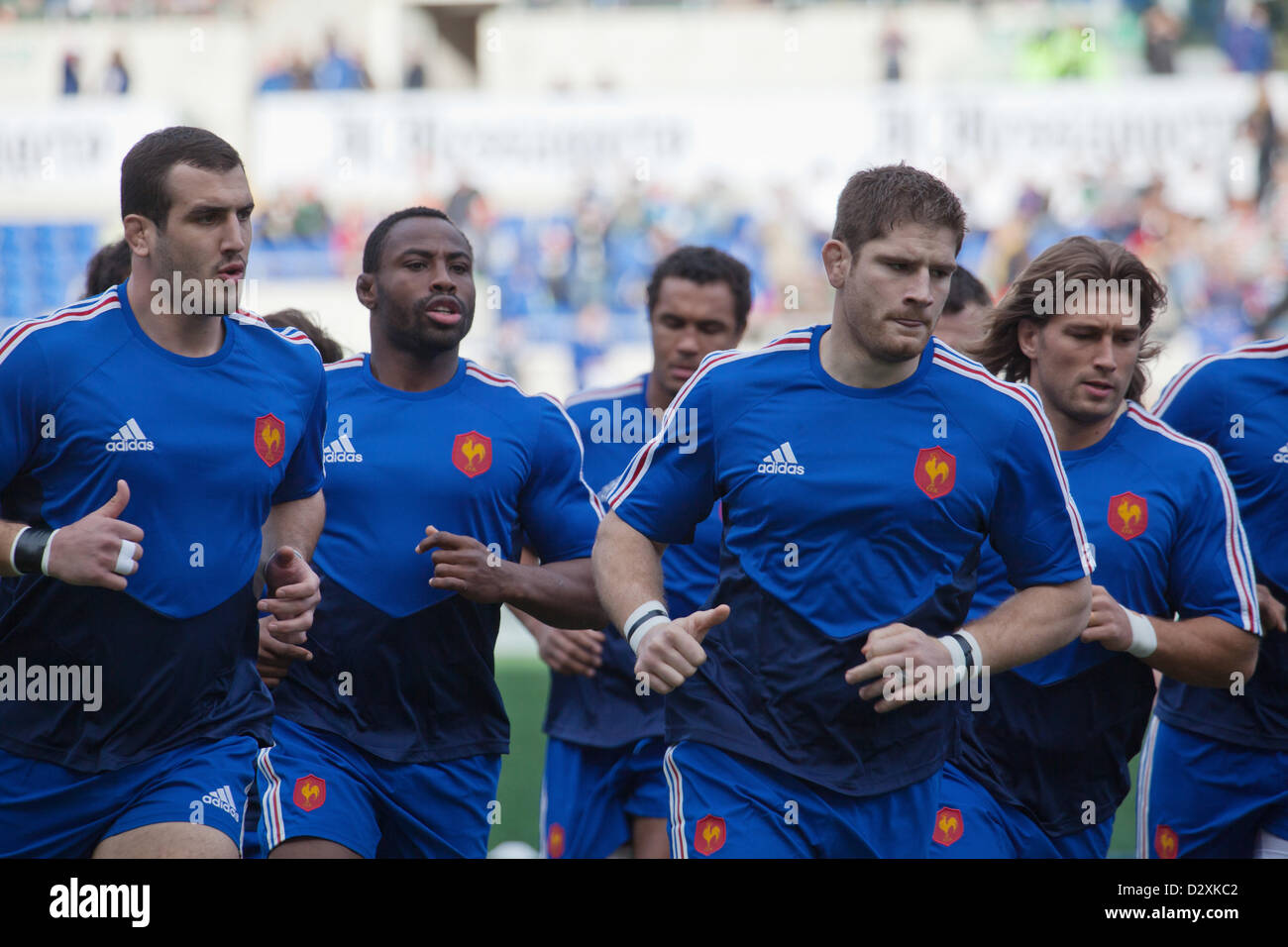 February 3rd 2013. Rome Italy. Six Nations rugby. Italy vs France. French team members jog round the pitch to warm up prior to kick off. L. to R. Frédéric Michalak; Fulgence Ouedraogo; Pascal Papé (Captain); Dimitri Szarzewski. Stock Photo