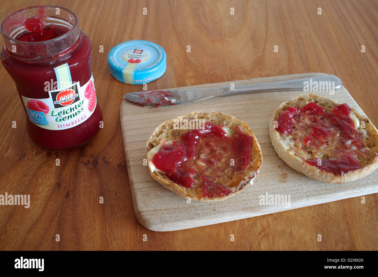 Toasted muffin with raspberry jam Stock Photo
