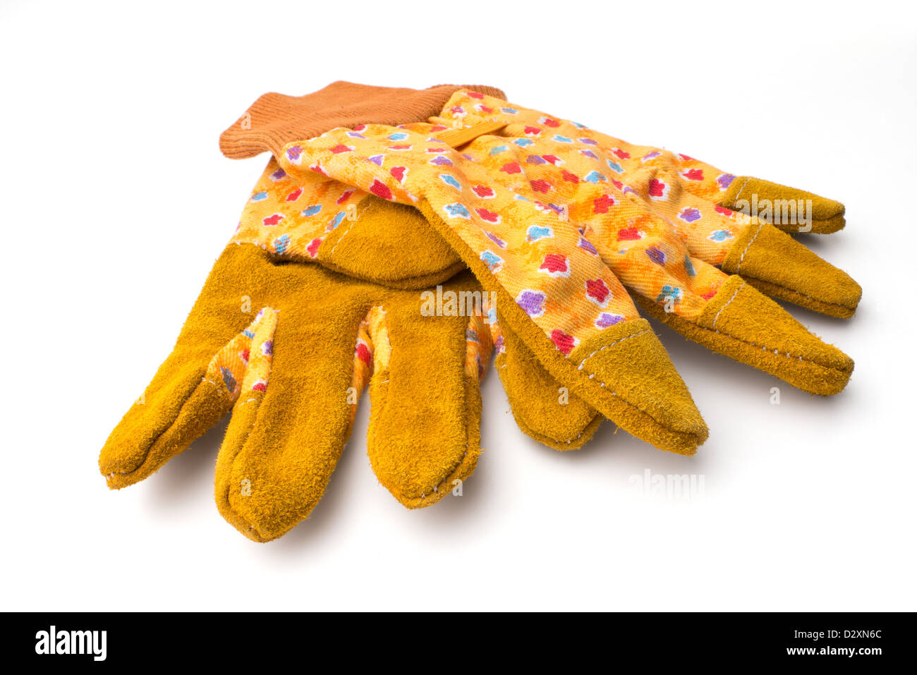 Gardening: pair of yellow gardeners protective gloves, isolated on white background Stock Photo