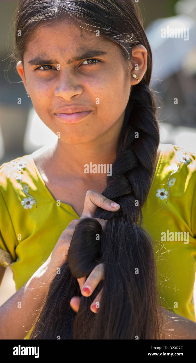 Rural Indian village girl plaiting her long hair. Andhra Pradesh, India  Stock Photo - Alamy