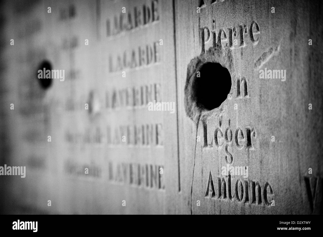 Bullet holes in a carved plinth in a church. Oradour-sur-Glane  France Stock Photo