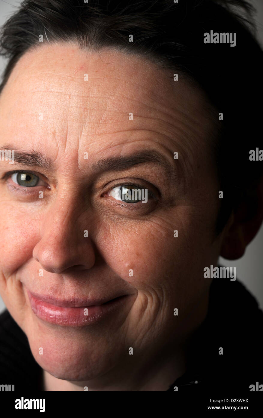Close up portrait of mature middle age woman in her 40s looking into camera Stock Photo
