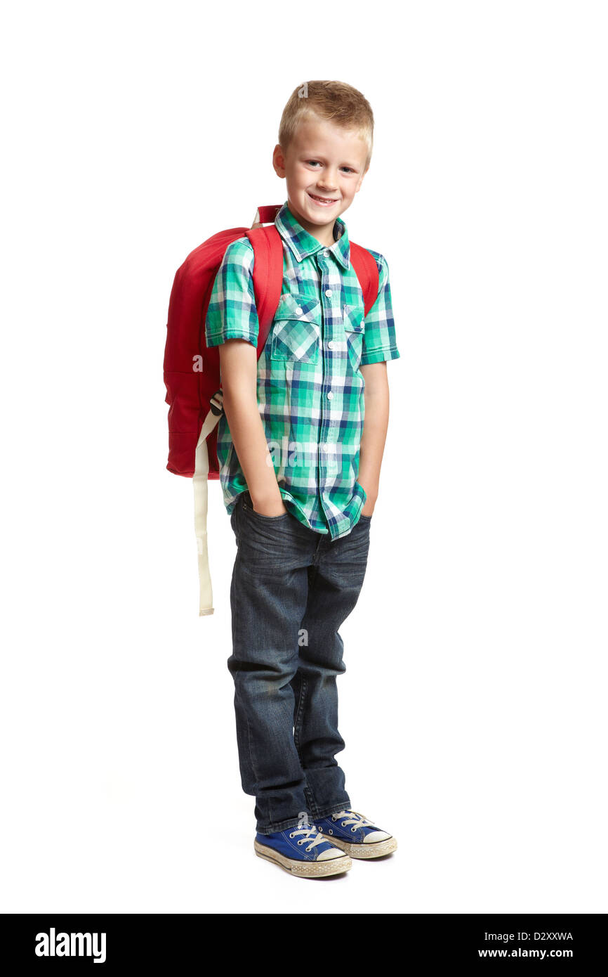 8 year old school boy with backpack on white background Stock Photo Alamy
