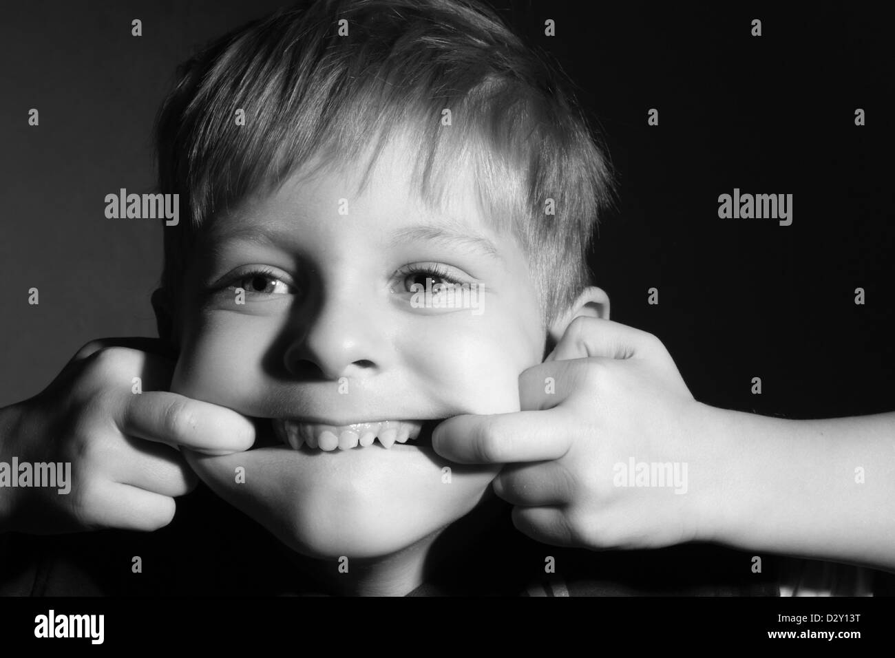 little boy make funny face, black and white Stock Photo