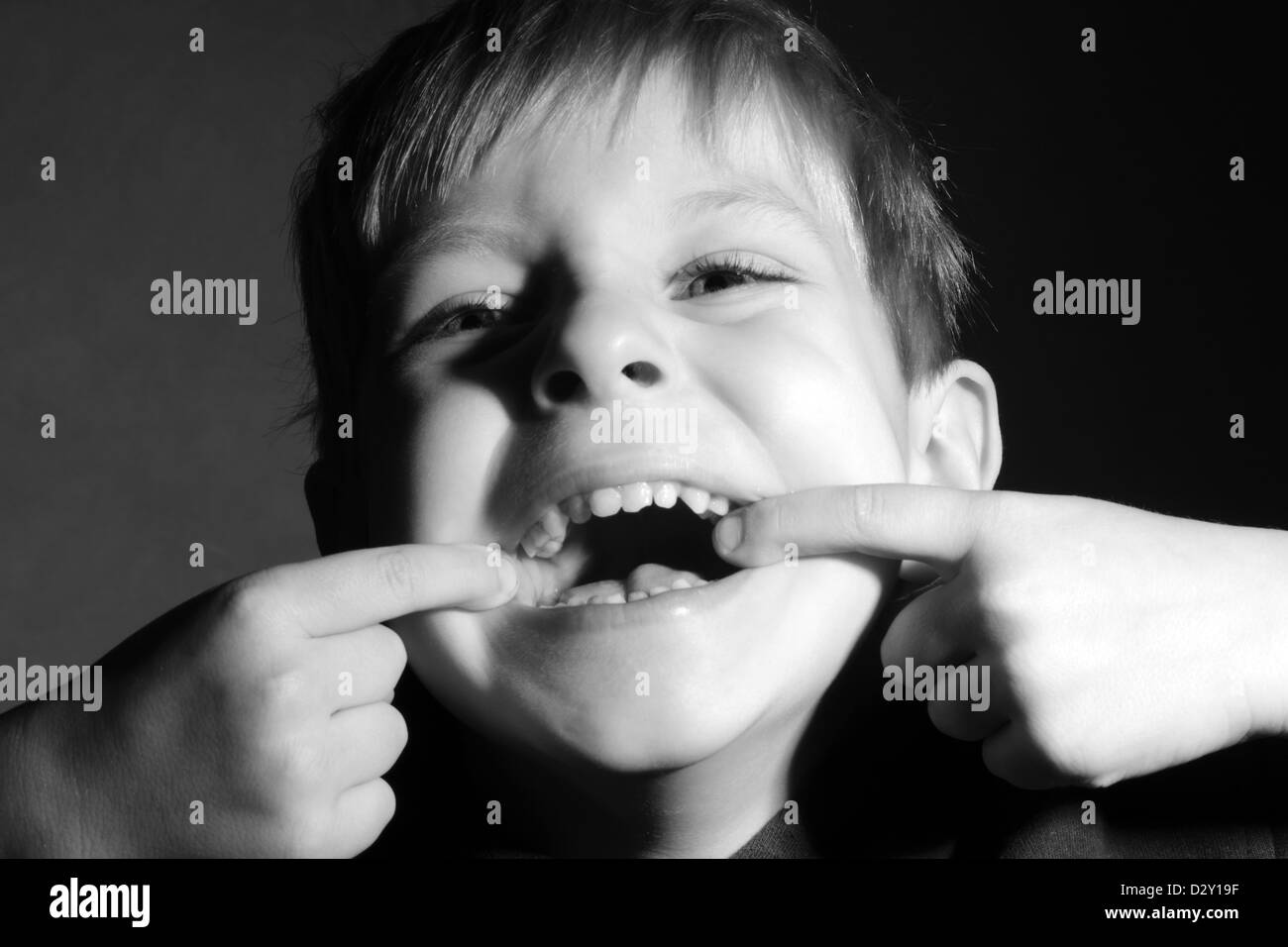 little boy make funny face, black and white Stock Photo