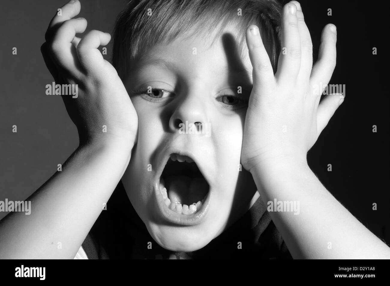 little boy make funny face, black and white Stock Photo