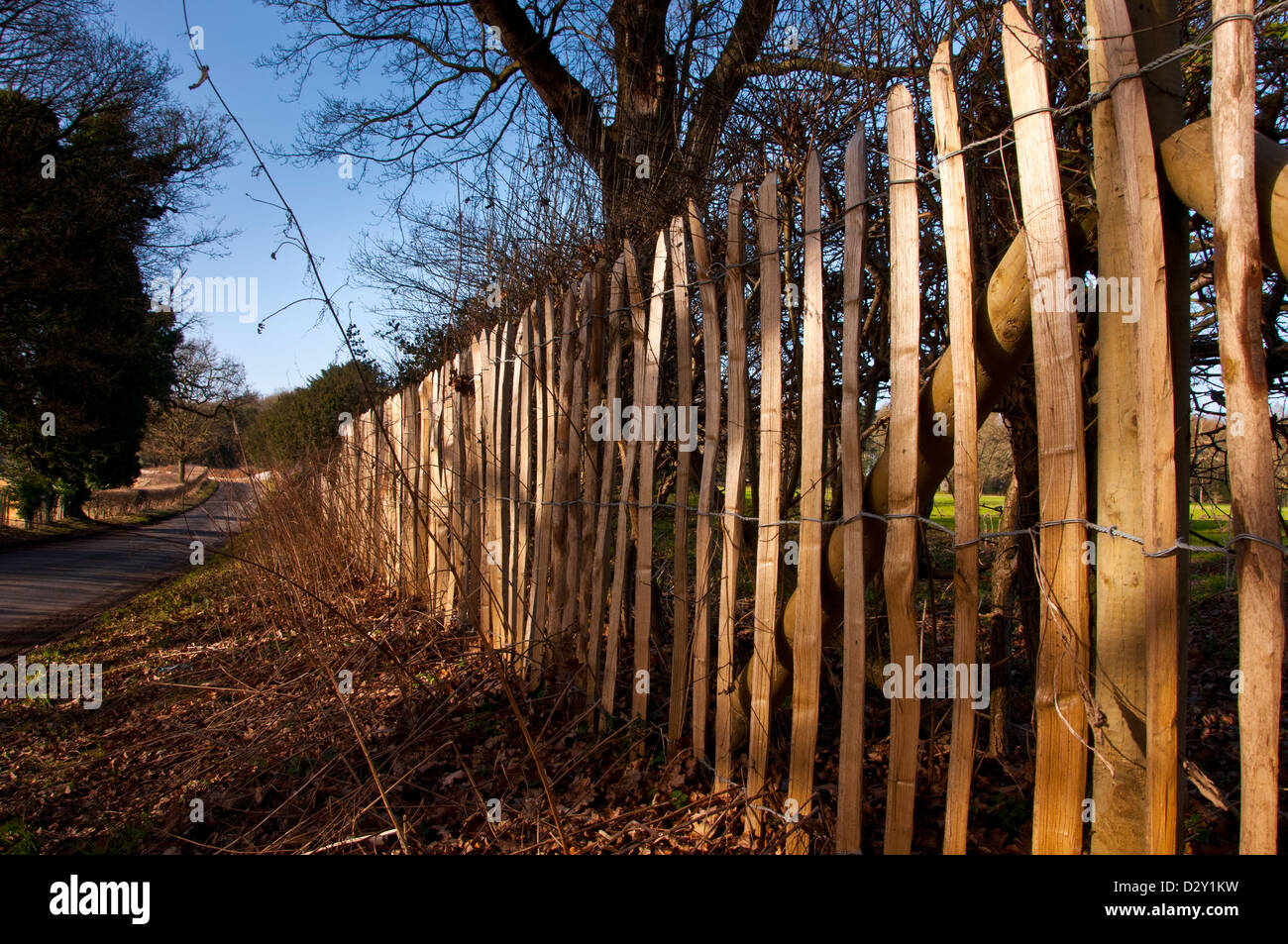 Chestnut Paling stick and wire fencing Stock Photo