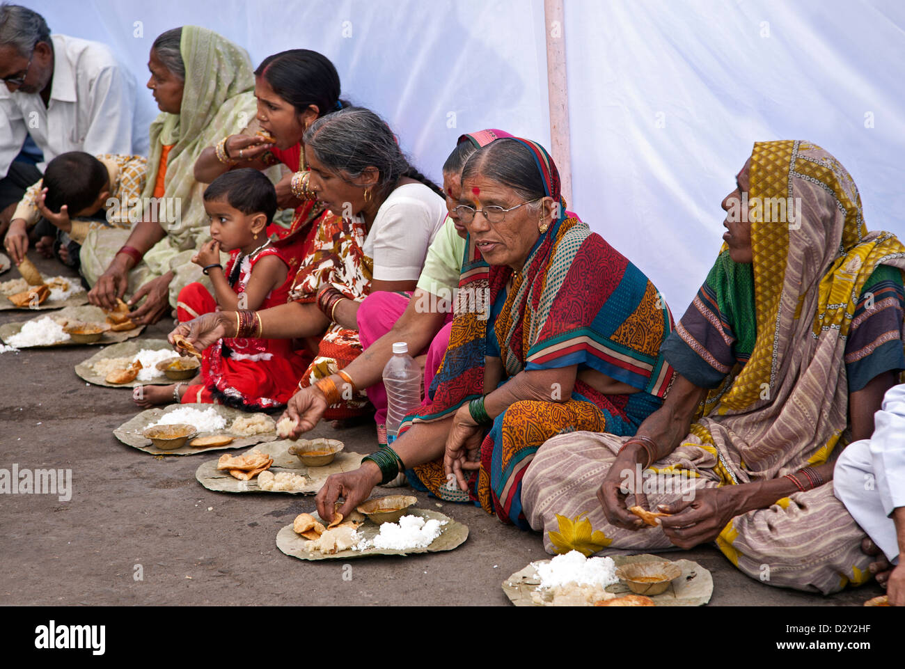 Indian women eating a thali (traditional meal). Varanasi (Benares). India Stock Photo
